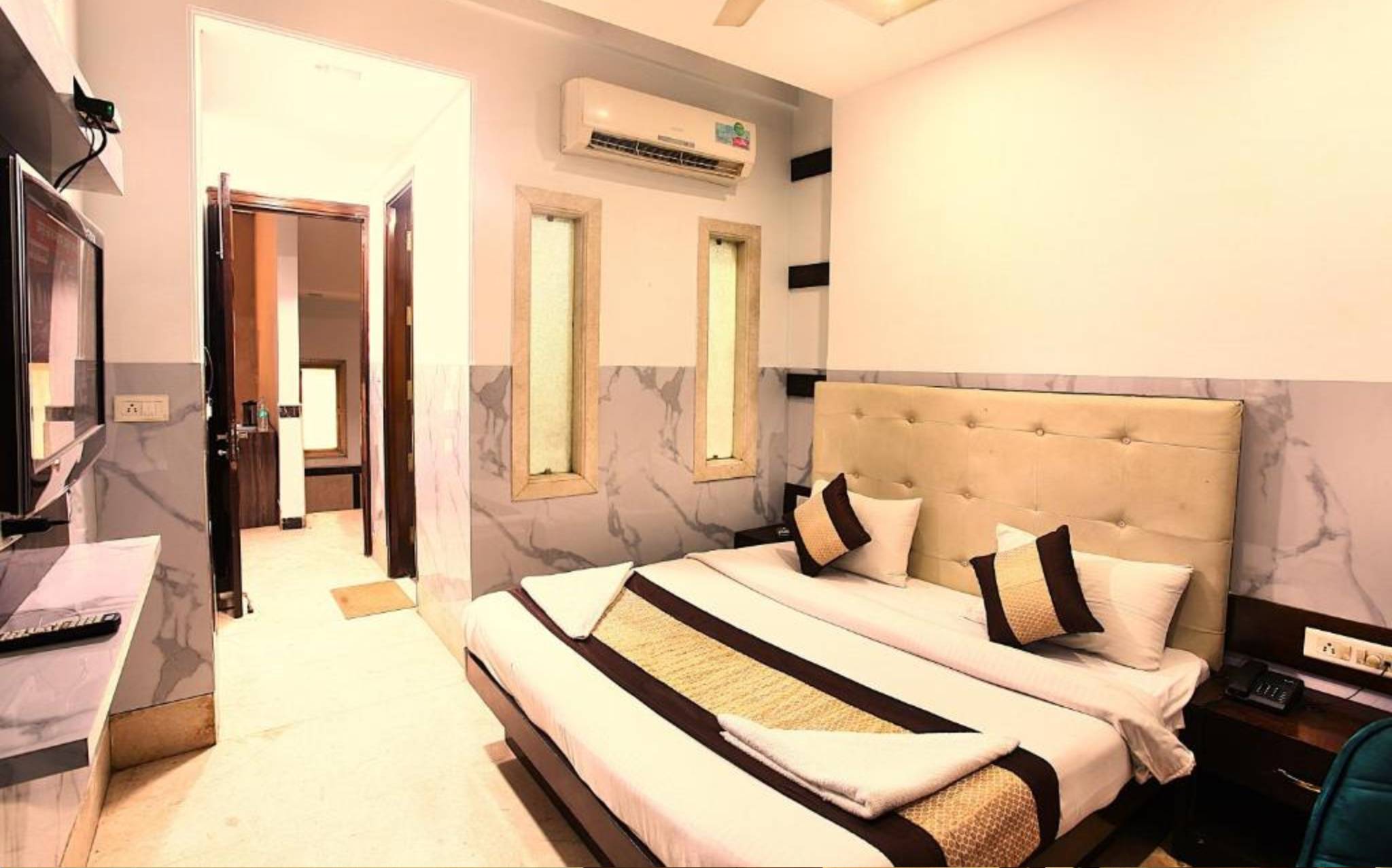 Super Deluxe AC Room at Hotel Taksh Inn — spacious and well-appointed